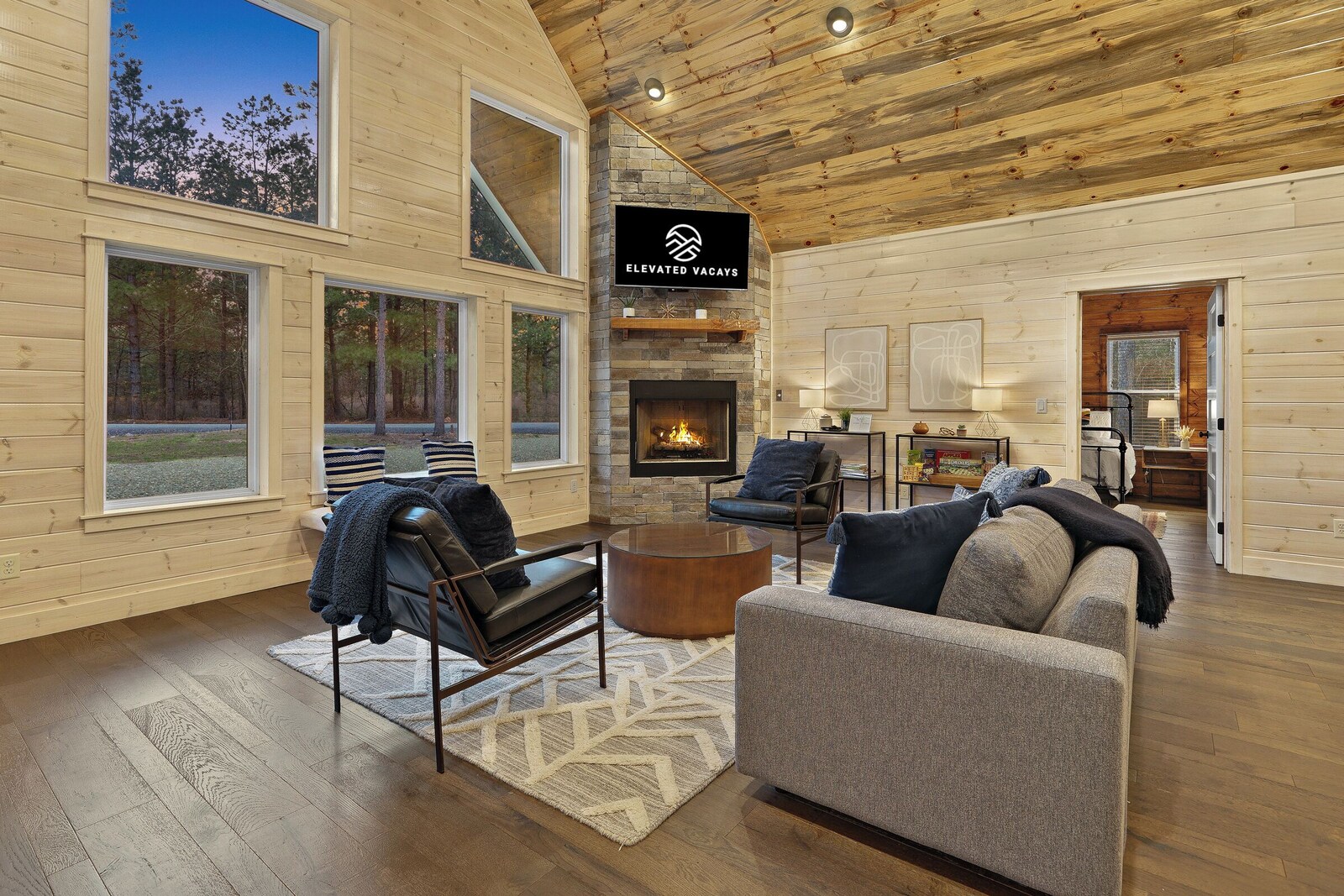 Spacious living room with fireplace and large windows