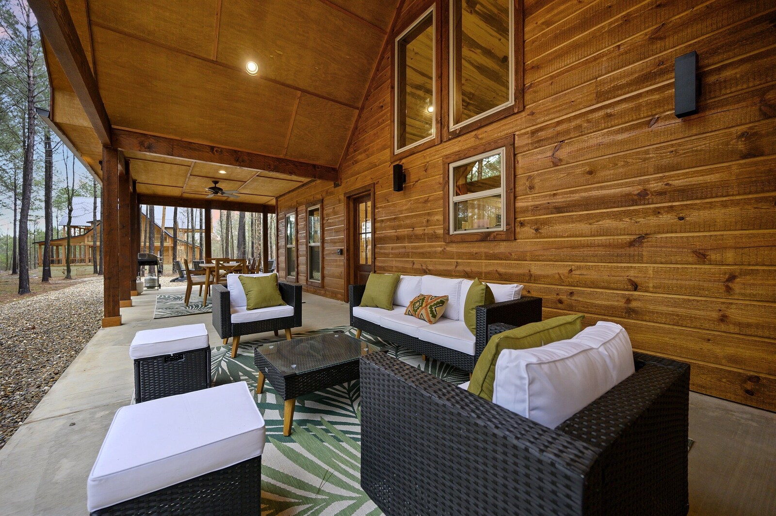 Emerald Escape covered porch with wicker seating