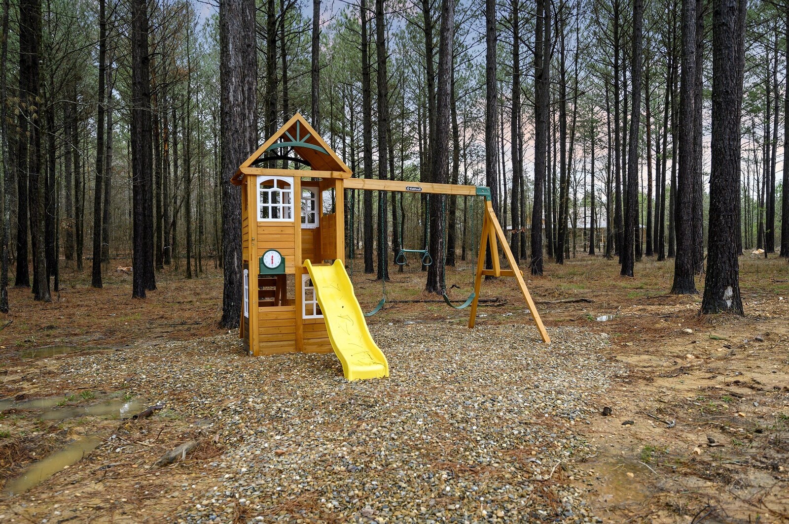 Kids playset with slide in the Emerald Escape yard