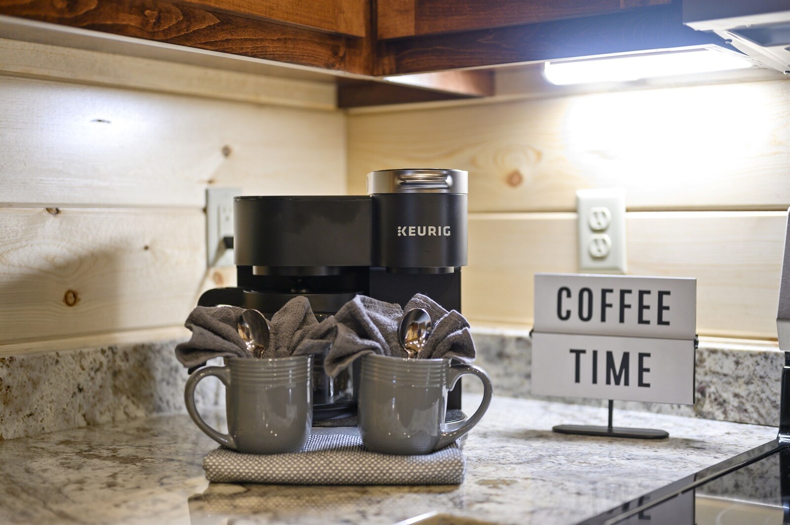Emerald Escape coffee bar with Keurig and mugs