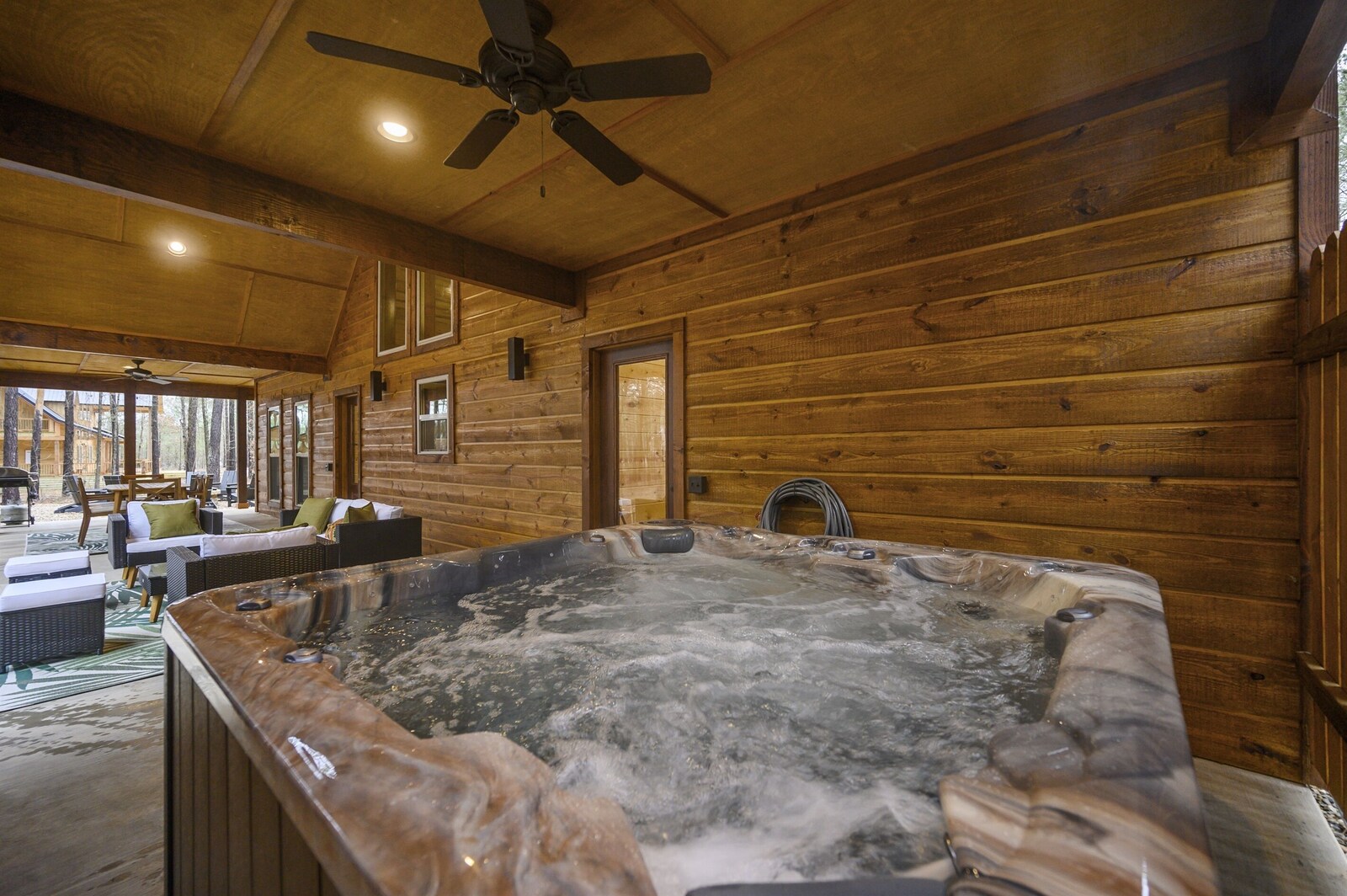 Emerald Escape hot tub on the covered porch