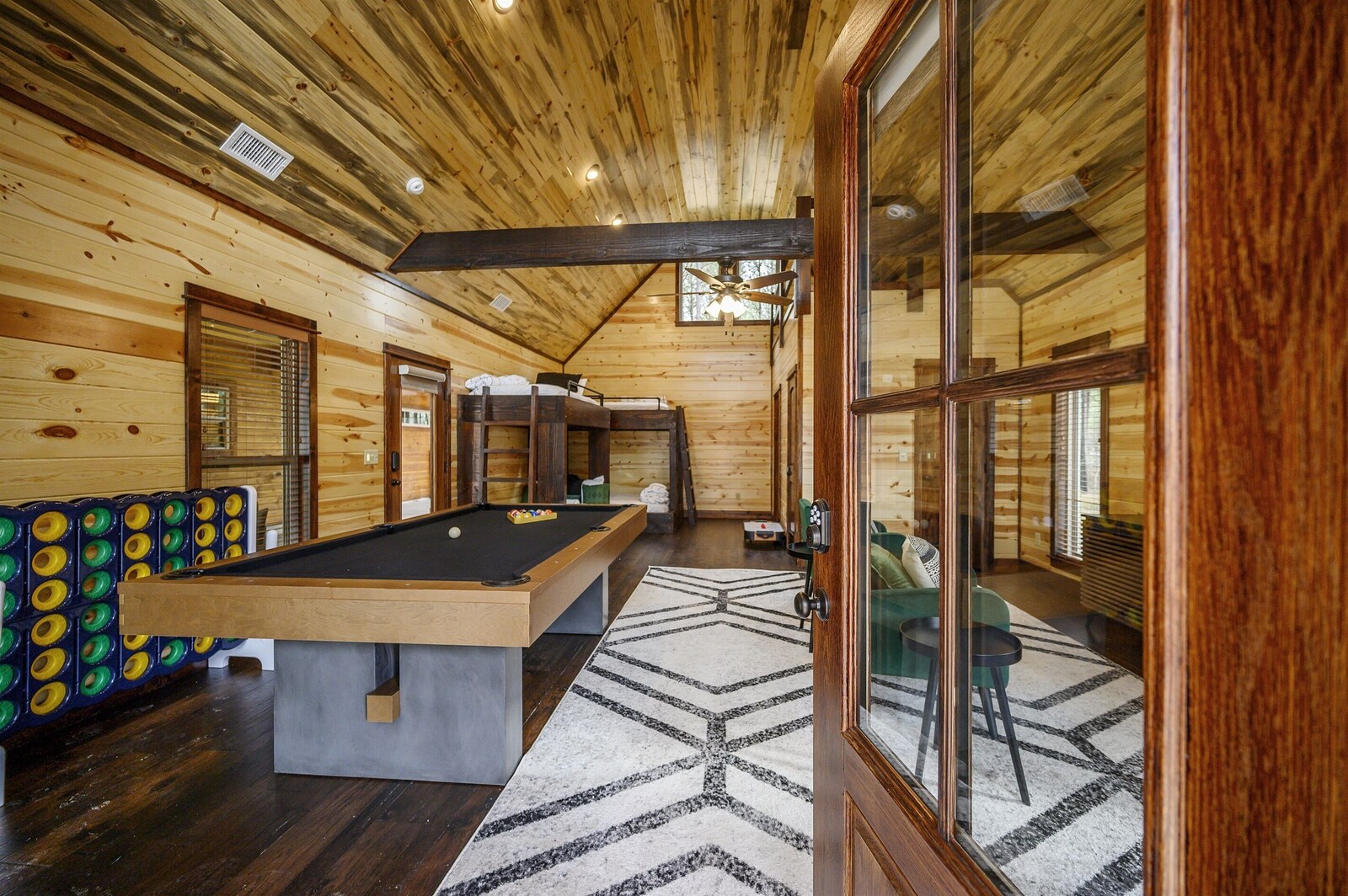 Emerald Escape game room with pool table and dining seating