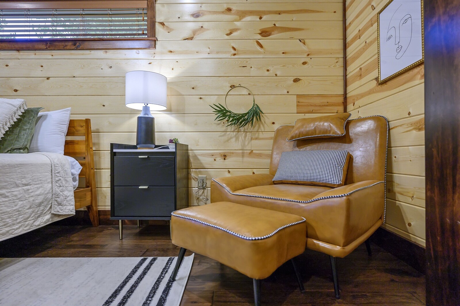 Emerald Escape bedroom with leather armchair and desk lamp