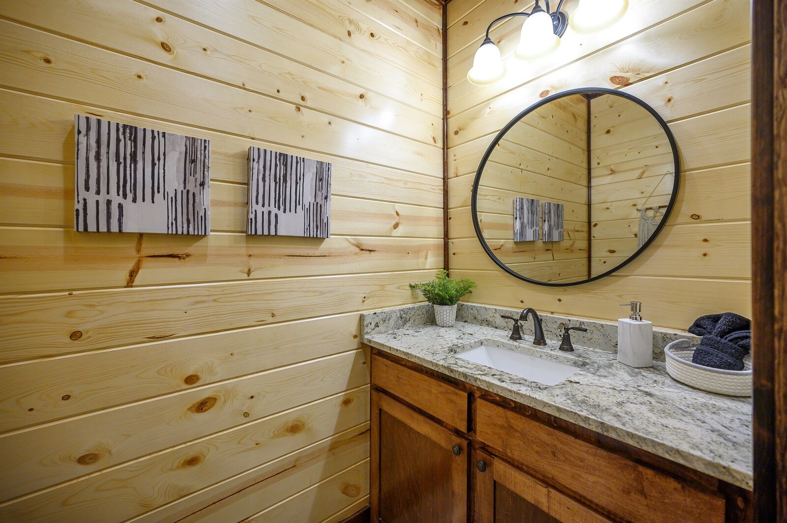 Emerald Escape half bath with wood paneling