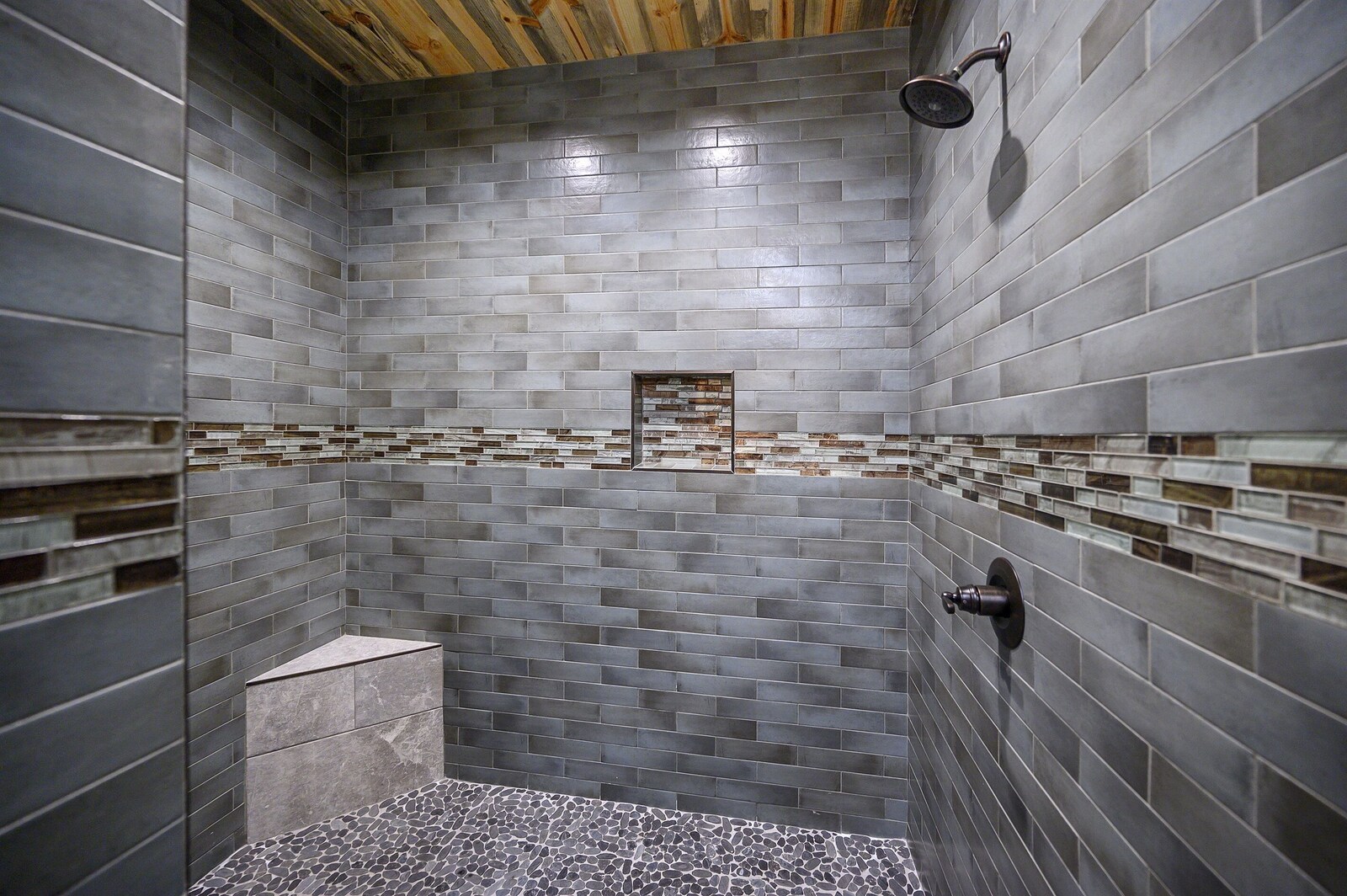 Emerald Escape tiled shower with mosaic border
