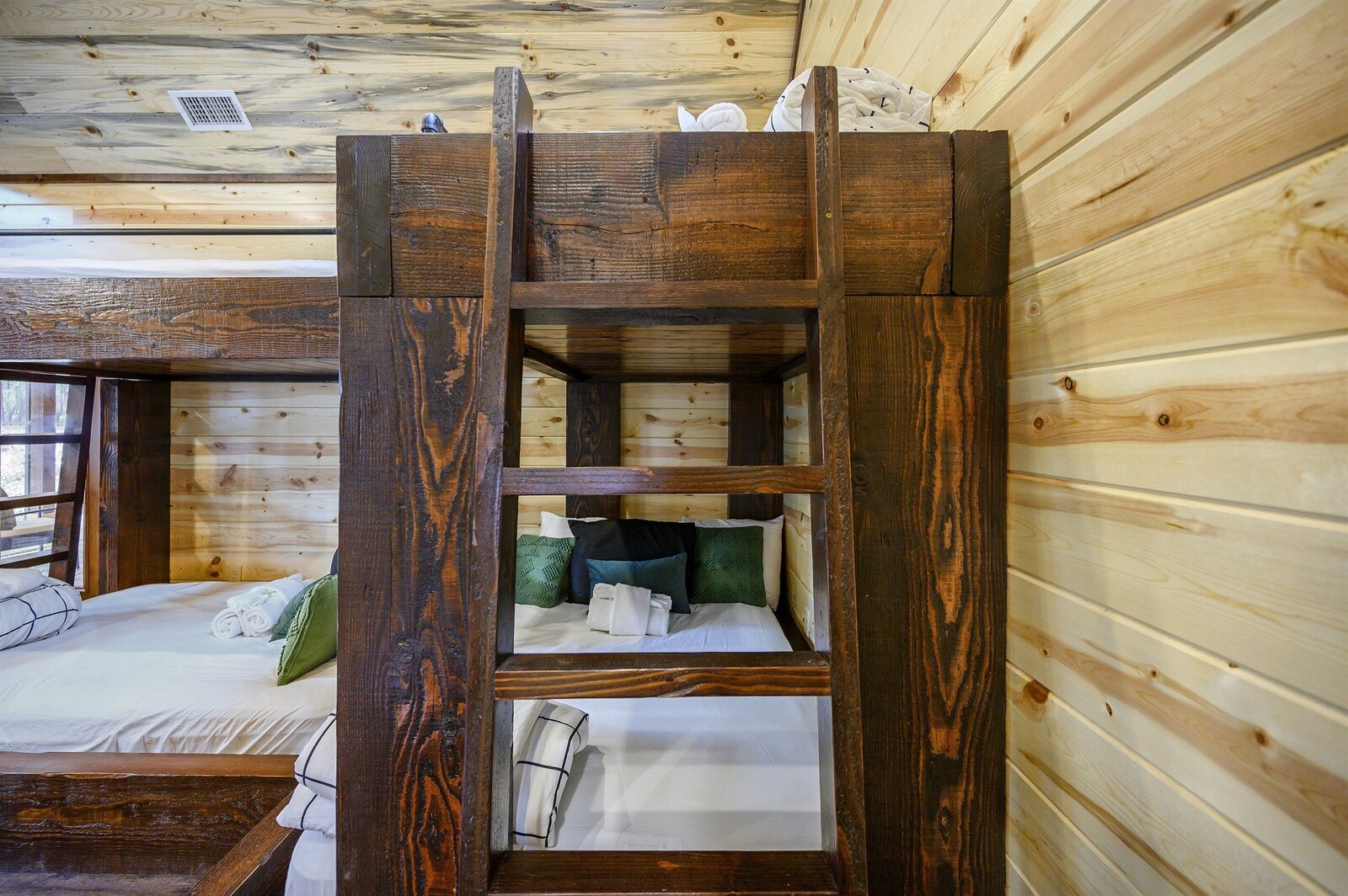 Emerald Escape bunk room with wood walls