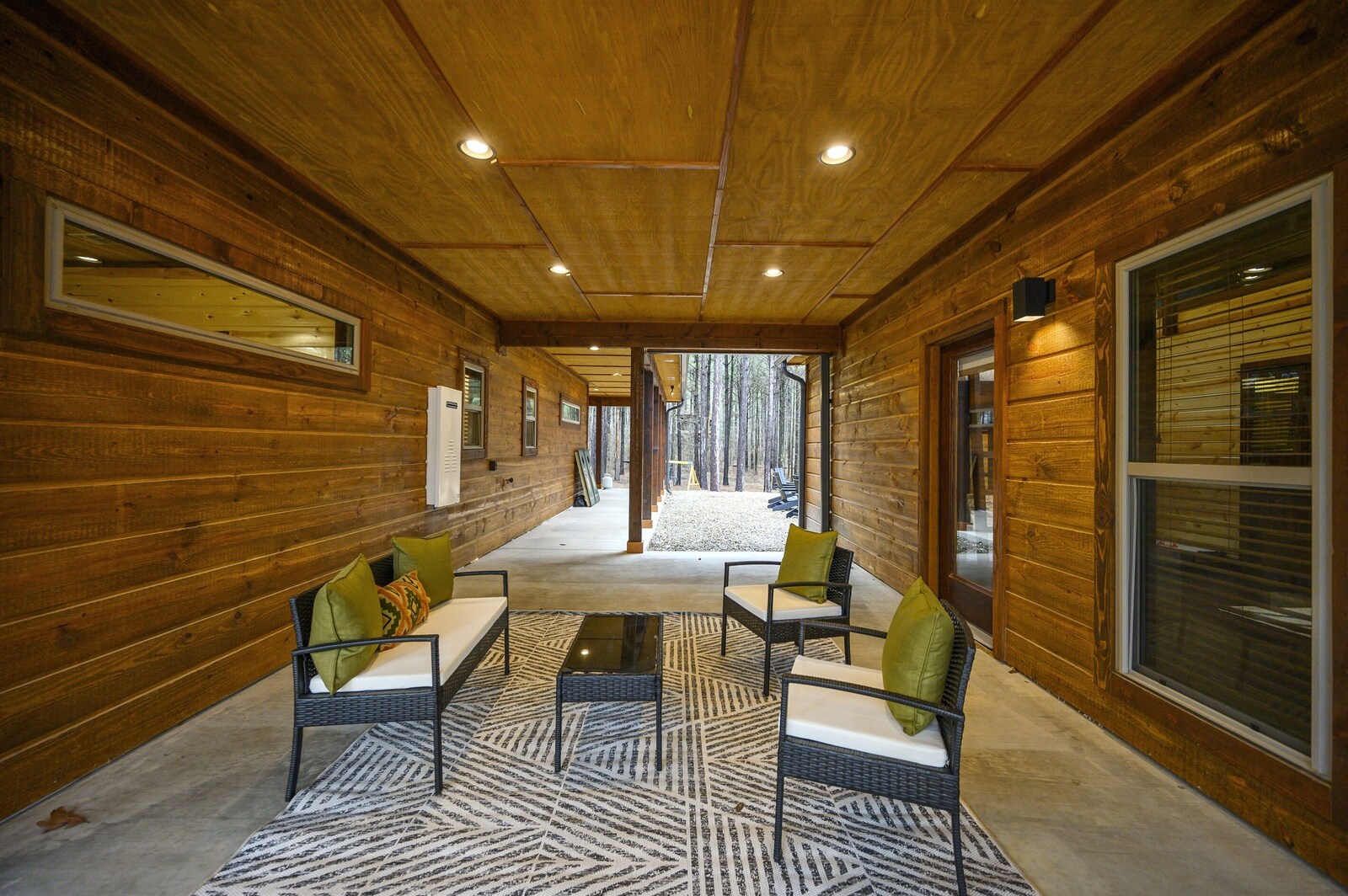 Emerald Escape sitting nook with sofa and patterned rug