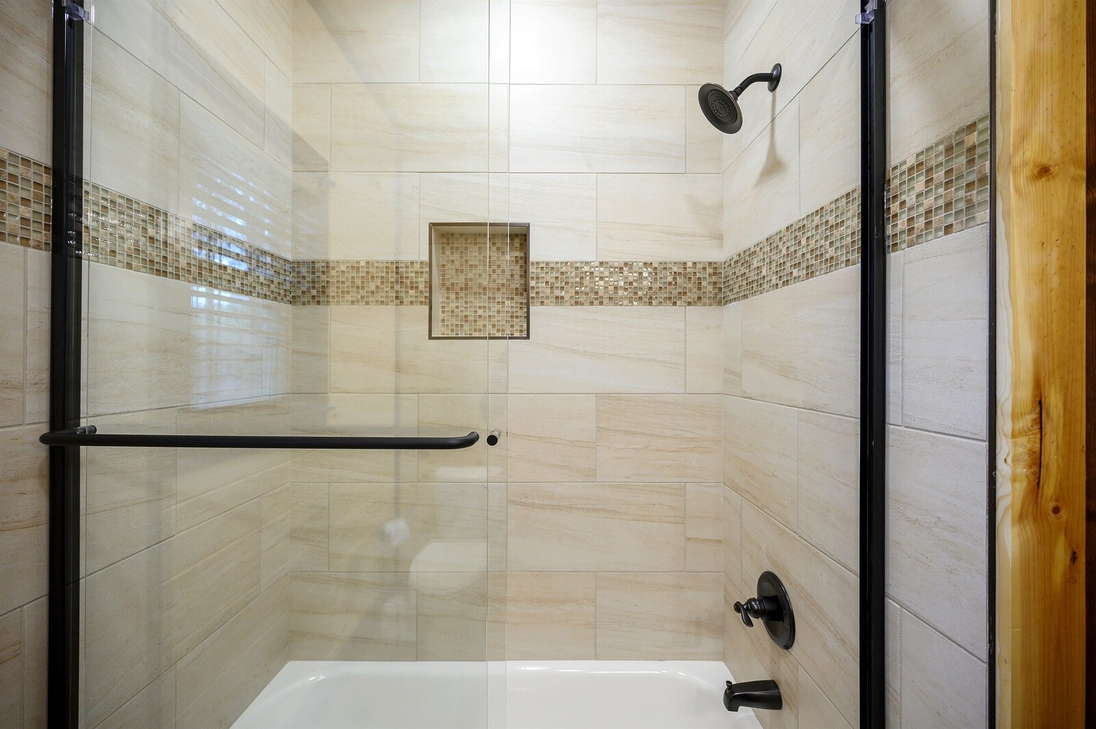 Emerald Escape walk-in shower with wood accent wall